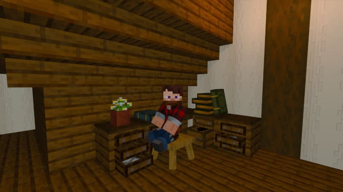 Игрок сидит на стуле в Minecraft